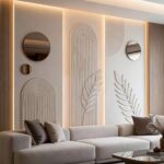Textured wall art panels with arched and leaf designs on a lit accent wall.